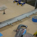 Adding spacer strips to side rails